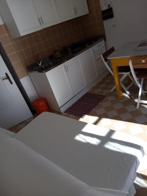 Kuchyň nebo kuchyňský kout v ubytování Appartamento in dimora tipica