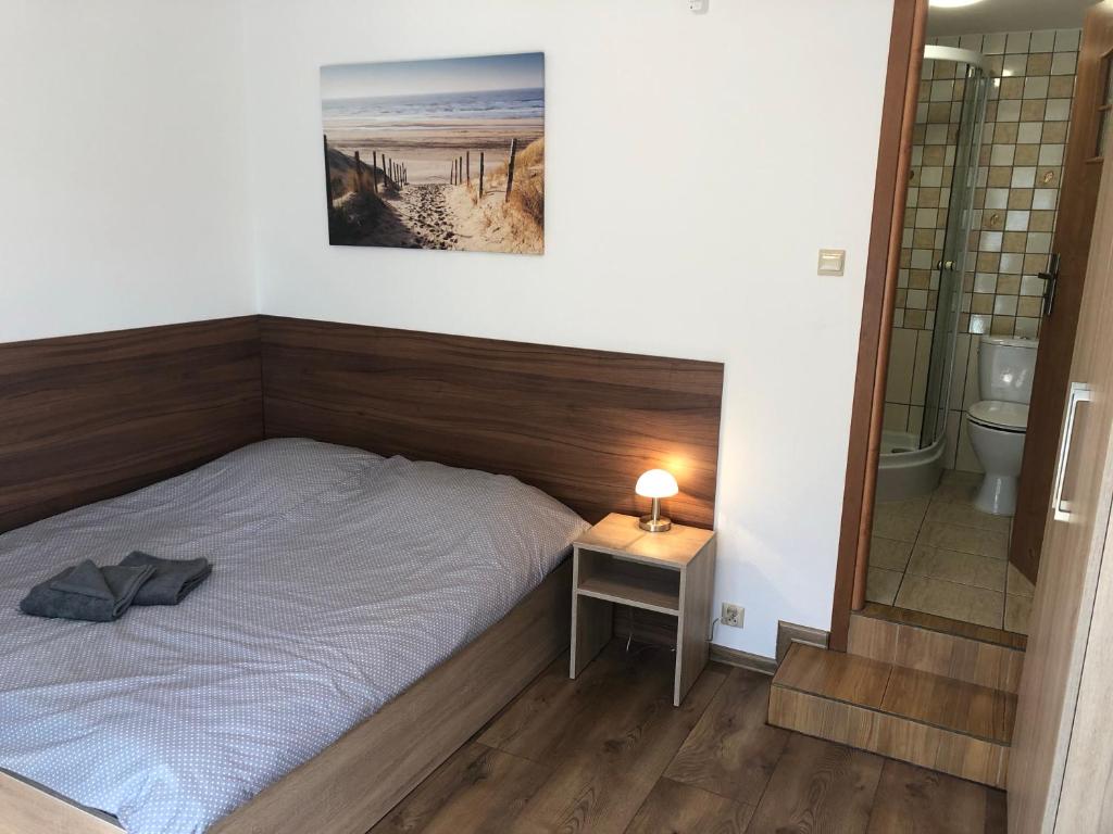 Posteľ alebo postele v izbe v ubytovaní Pod Winnym Gronem