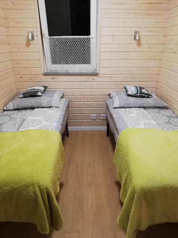 Posteľ alebo postele v izbe v ubytovaní Domek Pod Gruszą