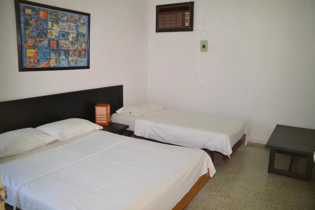 Postel nebo postele na pokoji v ubytování Hotel Albatros