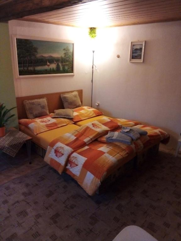 a bedroom with a large bed in a room at u Vlastika in Jeseník
