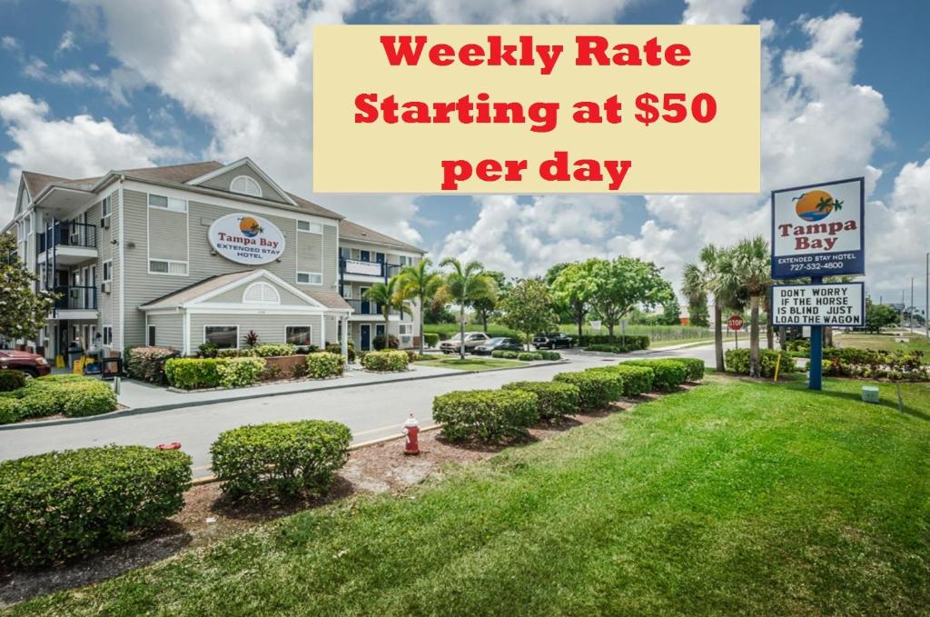a sign for afw rate starting at per day at a hotel at Tampa Bay Extended Stay Hotel in Largo