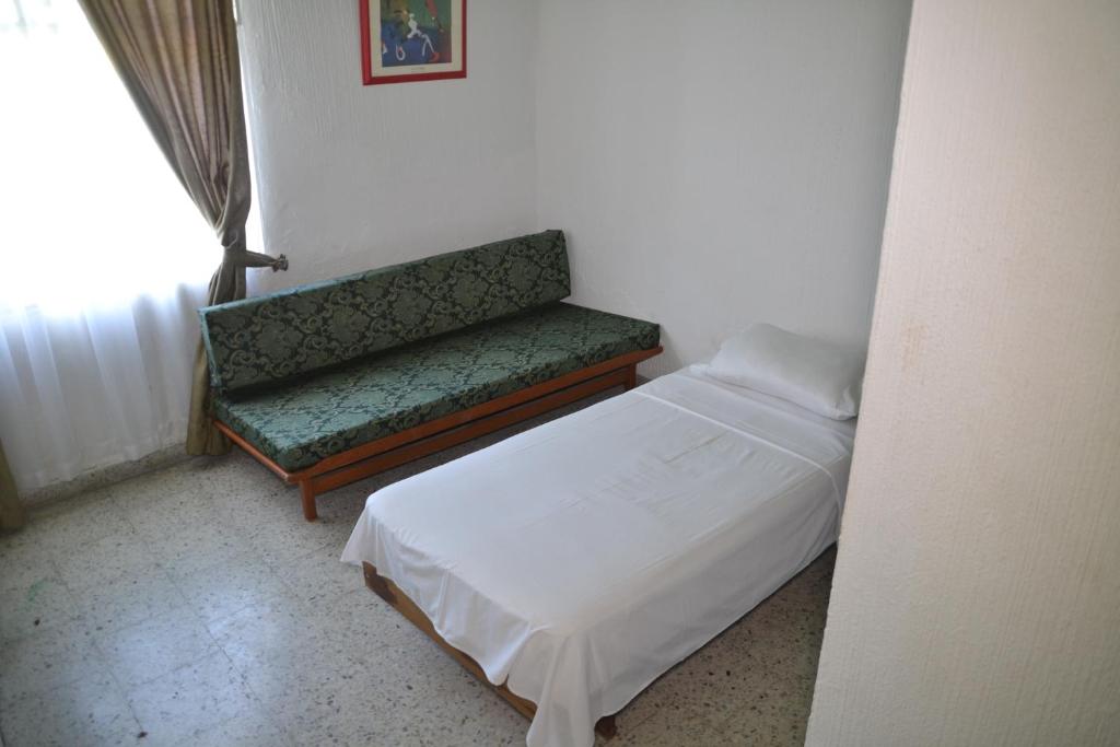 Postel nebo postele na pokoji v ubytování Hotel Albatros
