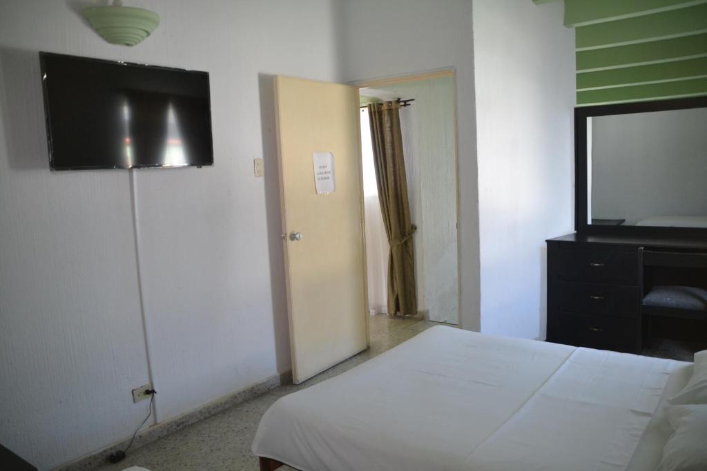 Postel nebo postele na pokoji v ubytování Hotel Albatros