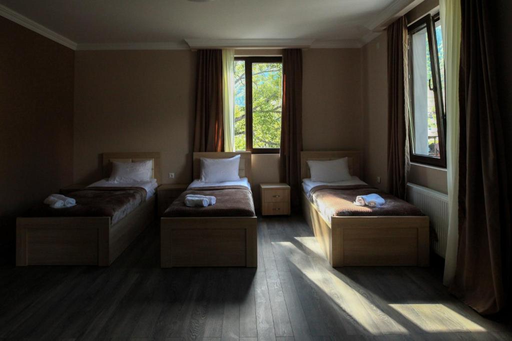 Postel nebo postele na pokoji v ubytování Hotel Patriot
