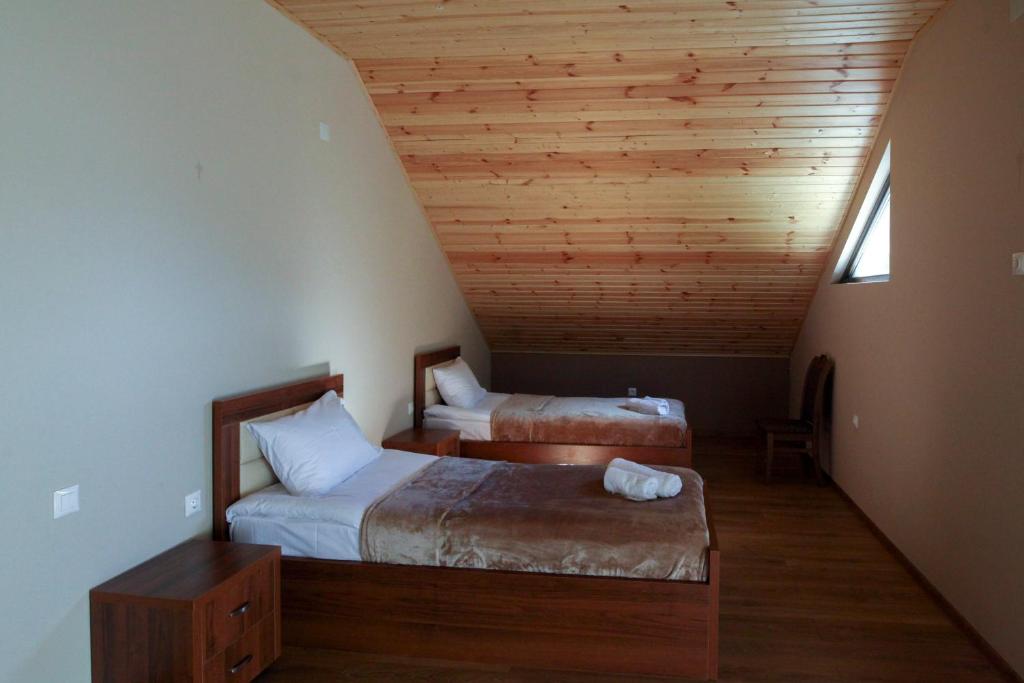 Postel nebo postele na pokoji v ubytování Hotel Patriot