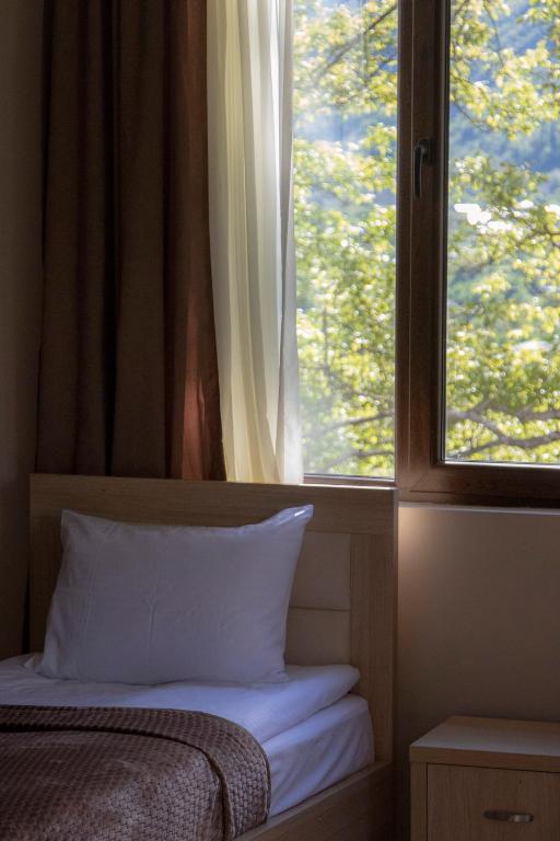 Postel nebo postele na pokoji v ubytování Hotel Patriot
