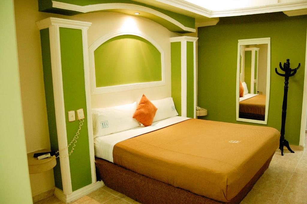 Postel nebo postele na pokoji v ubytování Hotel Porto Novo