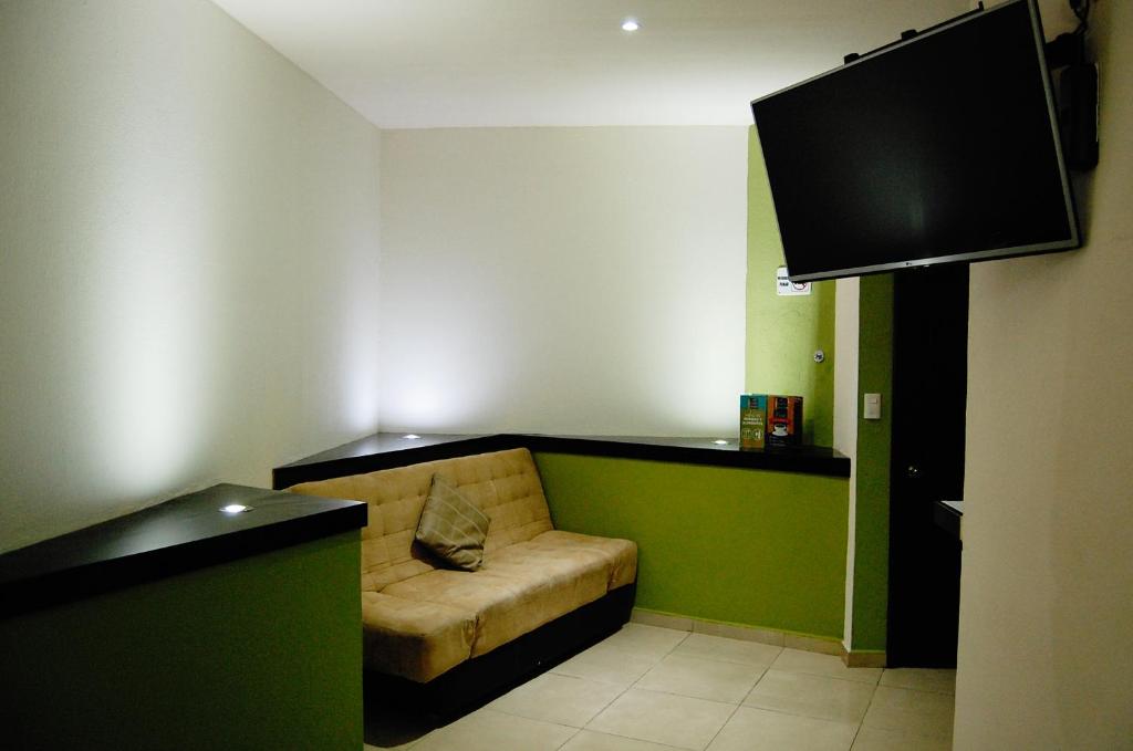 TV a/nebo společenská místnost v ubytování Hotel Porto Novo