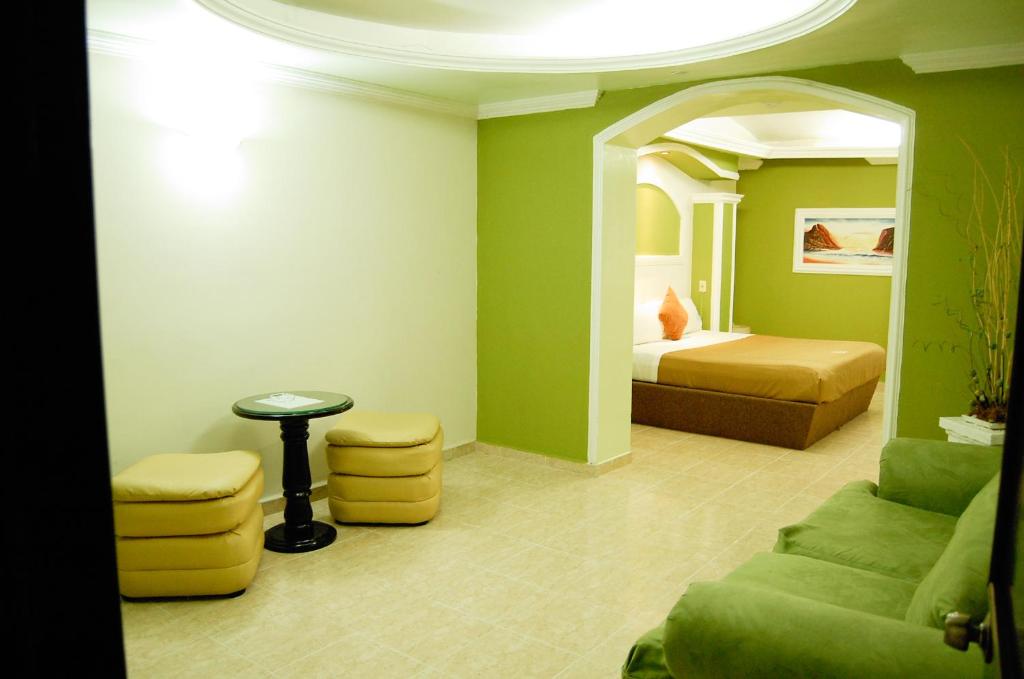 Postel nebo postele na pokoji v ubytování Hotel Porto Novo