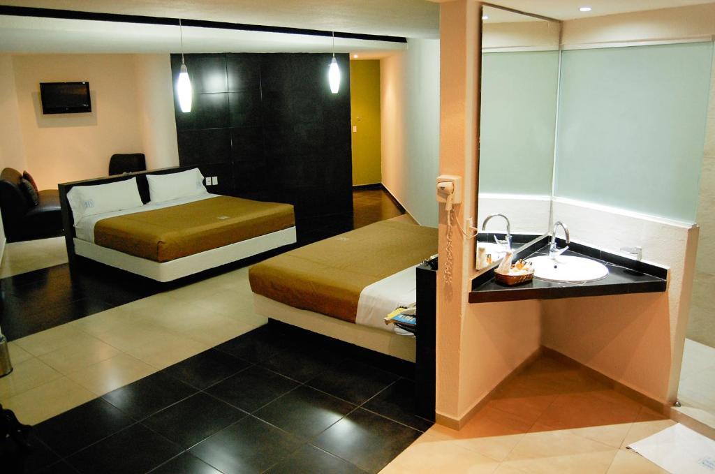 Postel nebo postele na pokoji v ubytování Hotel Porto Novo