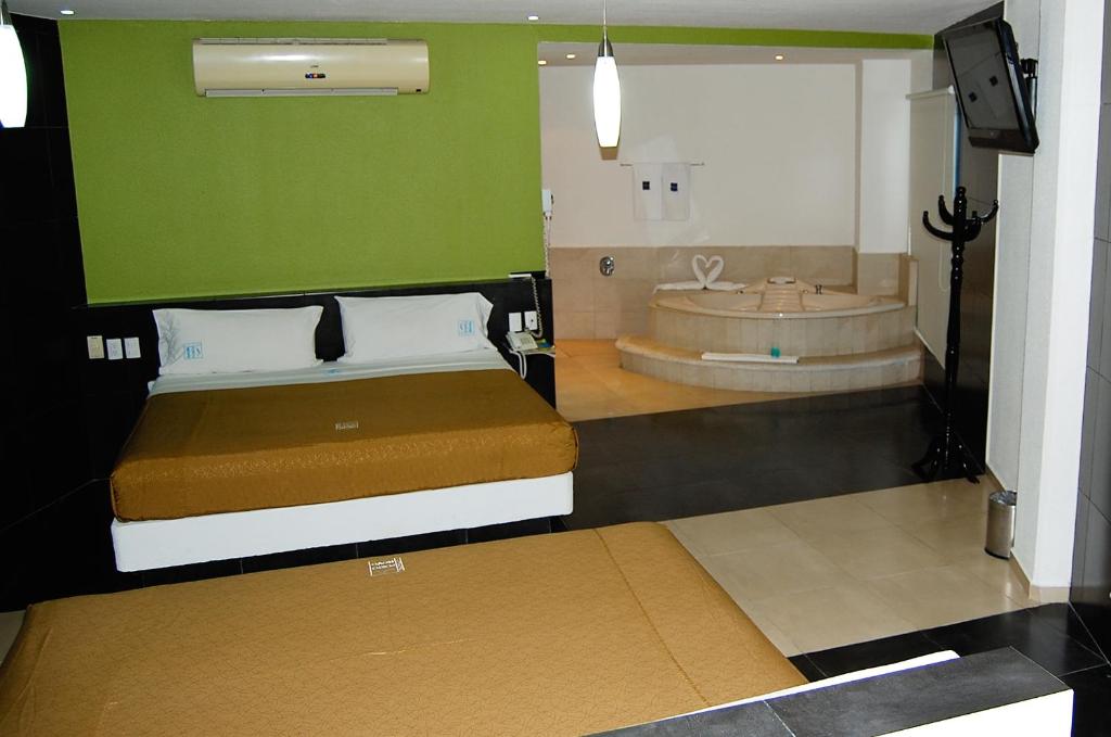 Postel nebo postele na pokoji v ubytování Hotel Porto Novo