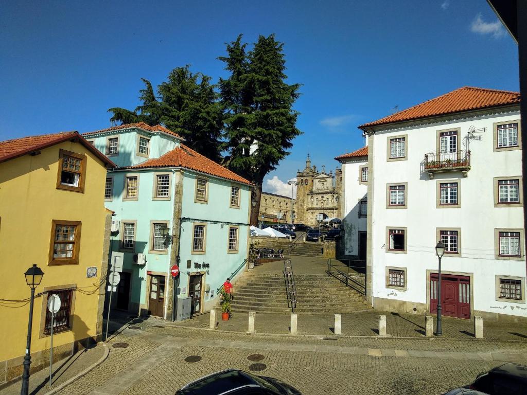 a group of buildings on a city street at Escadinhas da Sé in Viseu