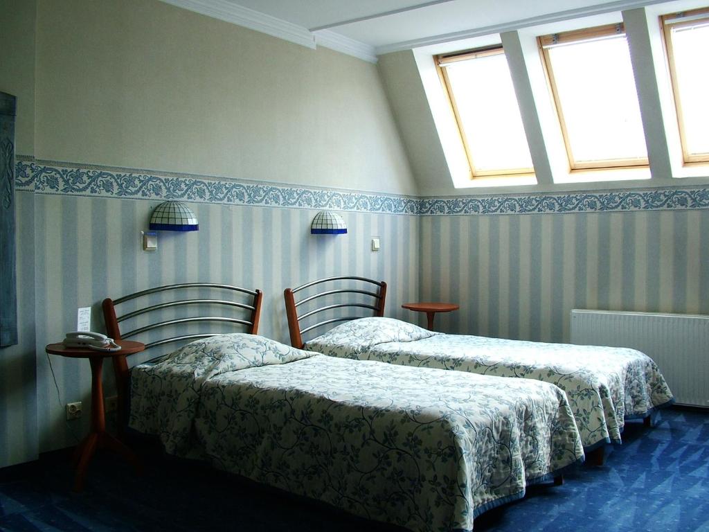 Posteľ alebo postele v izbe v ubytovaní Hotel Marmułowski