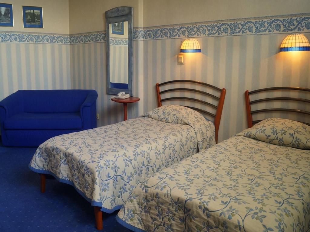 Posteľ alebo postele v izbe v ubytovaní Hotel Marmułowski