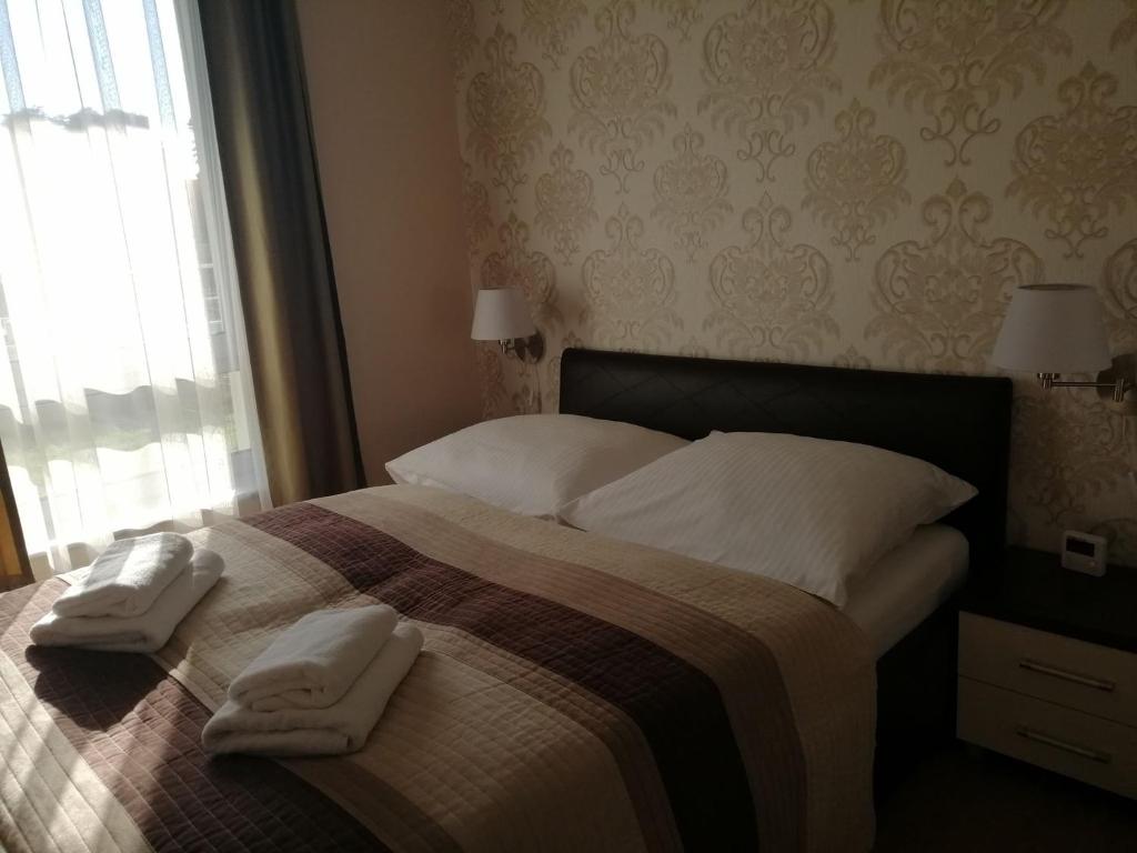 Posteľ alebo postele v izbe v ubytovaní Apartament Mariva B03 z ogródkiem - Pobierowo - blisko morza - przy kompleksie Grand Laola SPA