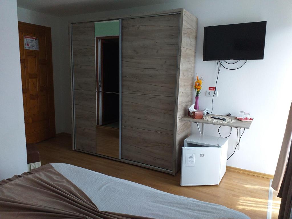 Postel nebo postele na pokoji v ubytování Casa Raluca