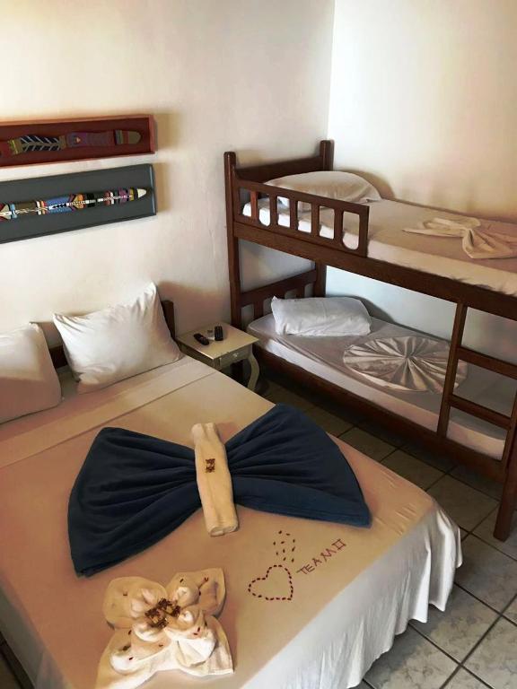 Postel nebo postele na pokoji v ubytování Pousada do Carlos