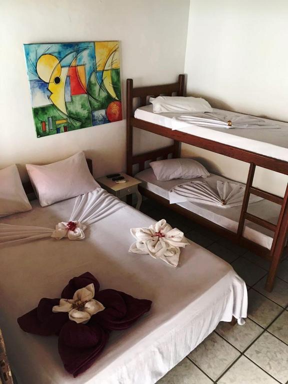 Postel nebo postele na pokoji v ubytování Pousada do Carlos
