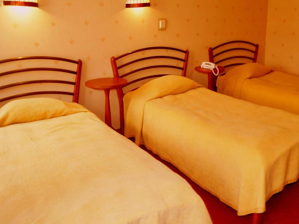 Posteľ alebo postele v izbe v ubytovaní Hotel Marmułowski