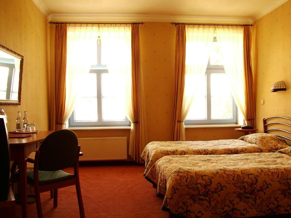 Posteľ alebo postele v izbe v ubytovaní Hotel Marmułowski