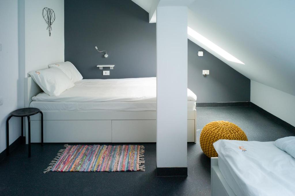 Postel nebo postele na pokoji v ubytování Good People Design Hostel