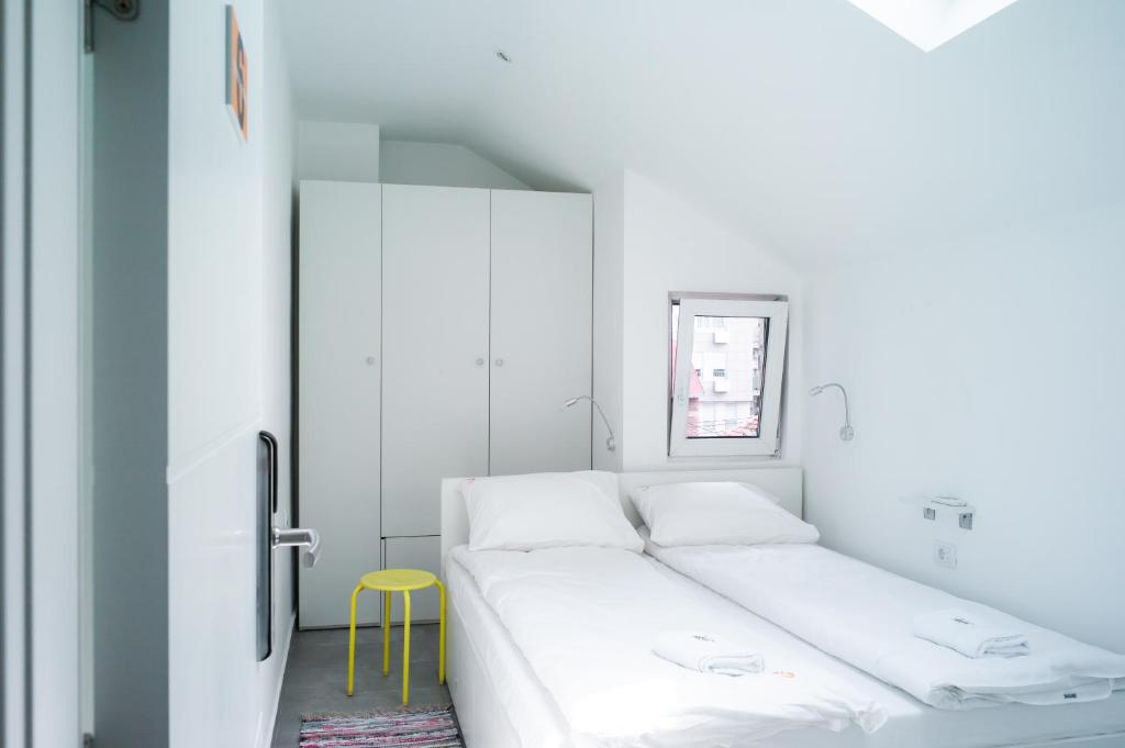 Postel nebo postele na pokoji v ubytování Good People Design Hostel
