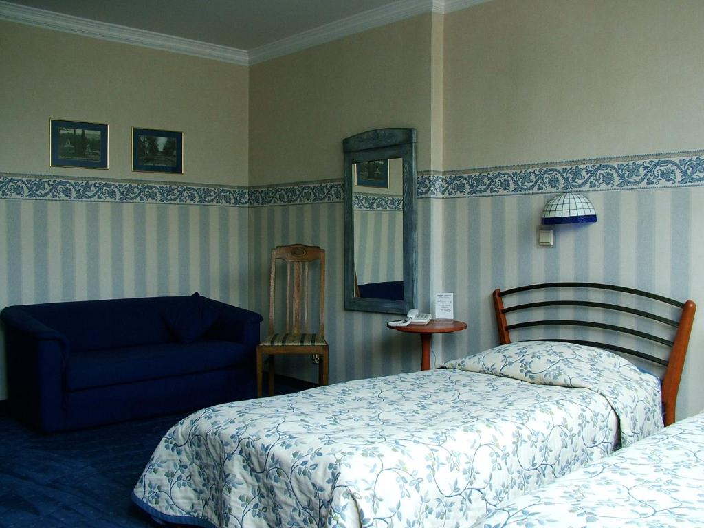 Posteľ alebo postele v izbe v ubytovaní Hotel Marmułowski