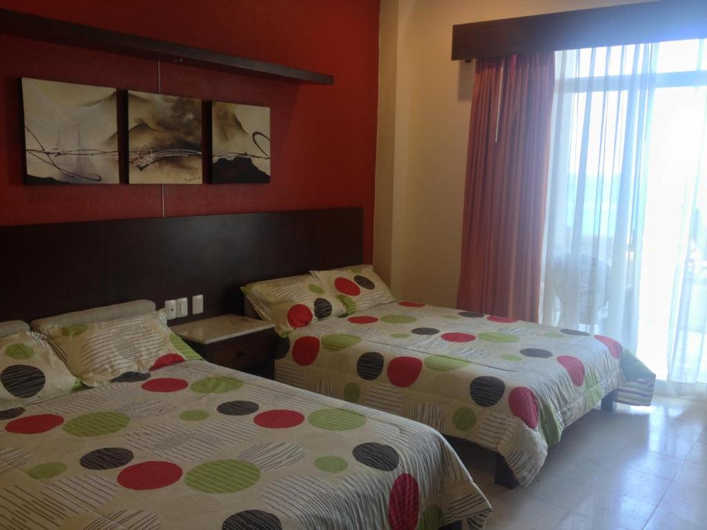 Postel nebo postele na pokoji v ubytování Hotel Bogavante
