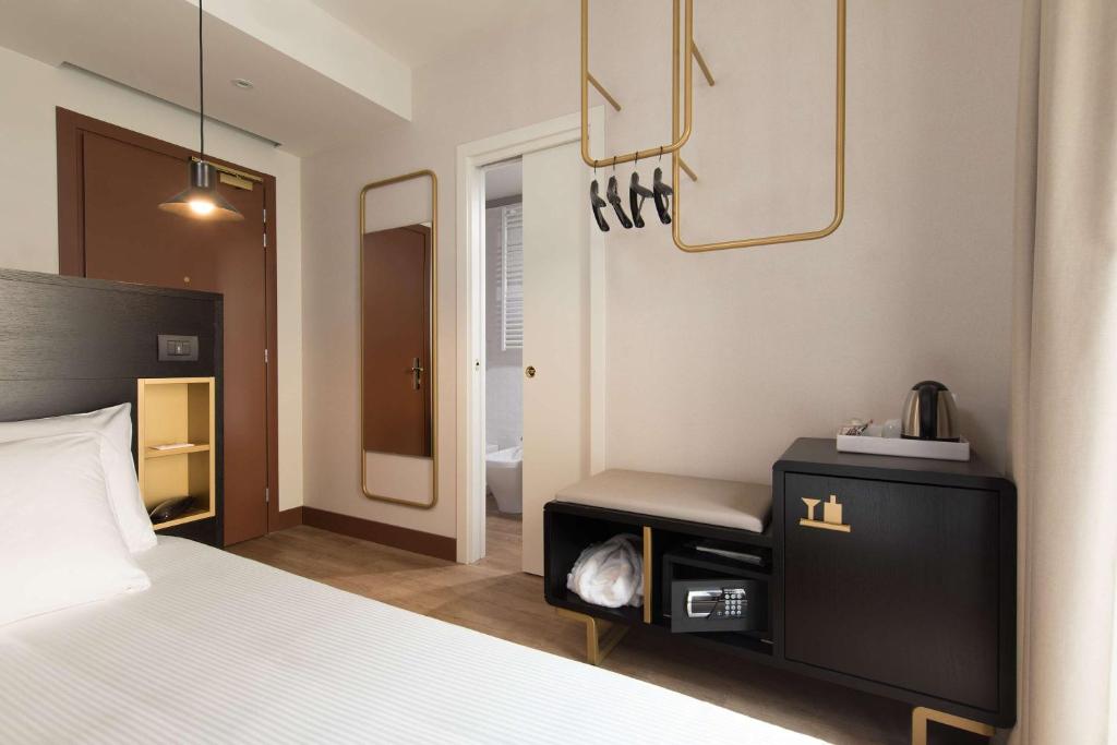Postel nebo postele na pokoji v ubytování Best Western Hotel Tritone