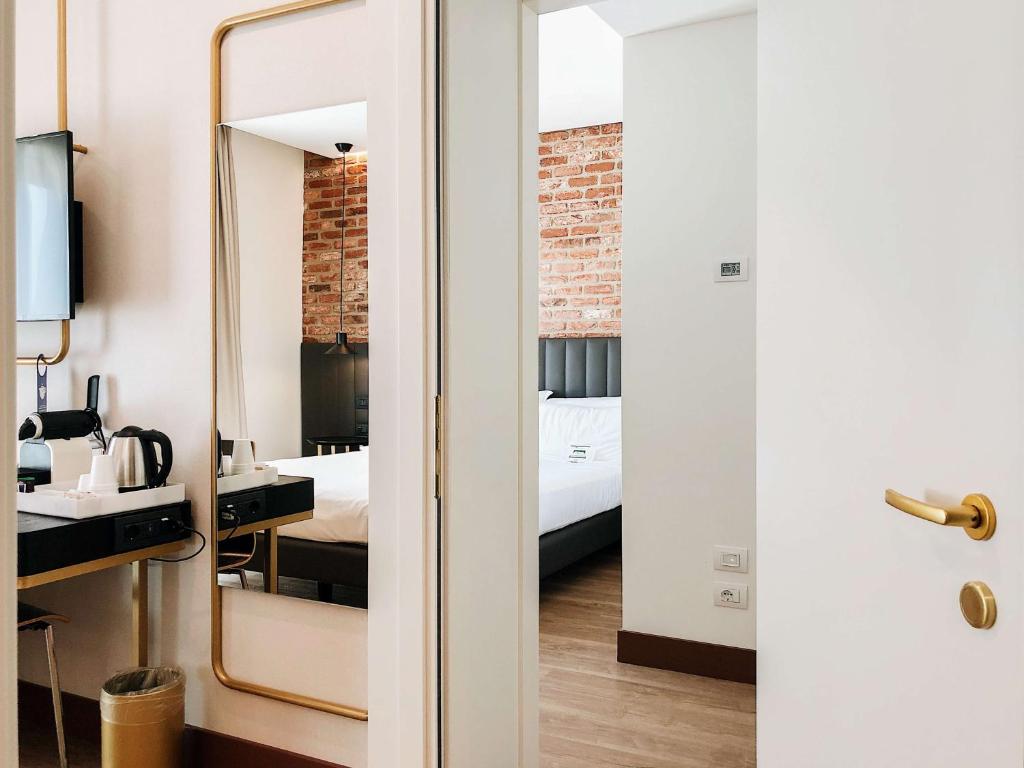 Postel nebo postele na pokoji v ubytování Best Western Hotel Tritone