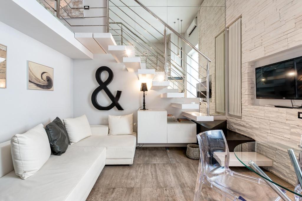 Televízia a/alebo spoločenská miestnosť v ubytovaní IREX Tevere Sant Angelo private apartment