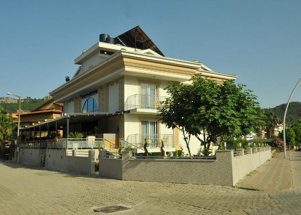 a house on the side of a street at THe NORDİC HOTEL in Kemer