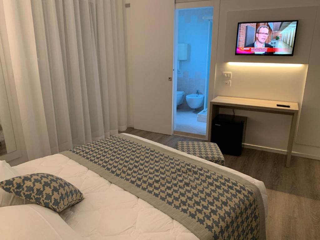 Un pat sau paturi într-o cameră la Hotel Jet