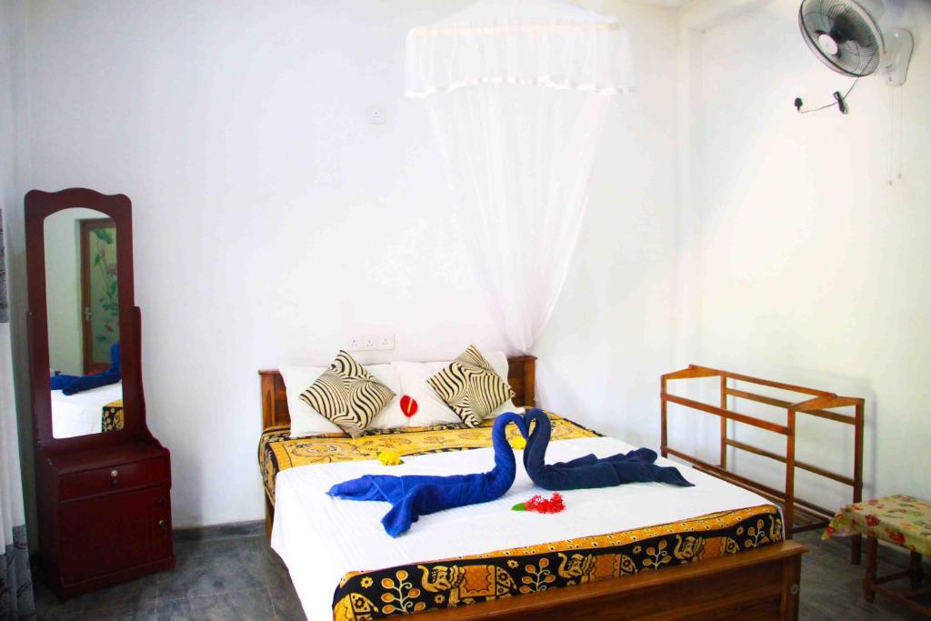 Postel nebo postele na pokoji v ubytování Amba Sewana Homestay