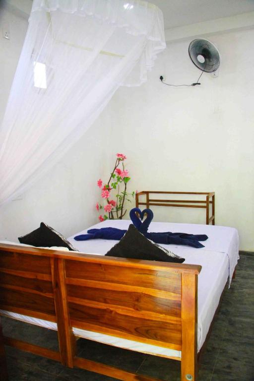 Postel nebo postele na pokoji v ubytování Amba Sewana Homestay