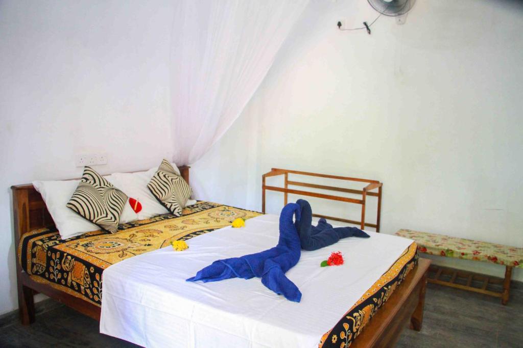 Postel nebo postele na pokoji v ubytování Amba Sewana Homestay