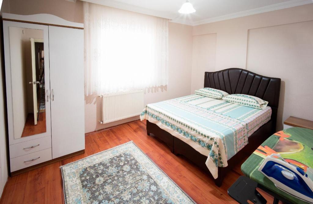 Postel nebo postele na pokoji v ubytování Cayeli Kent Apart
