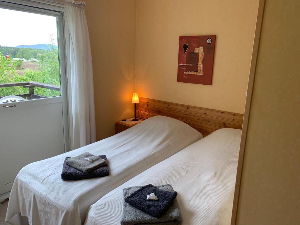 Postel nebo postele na pokoji v ubytování Kullerbacka Gästhus