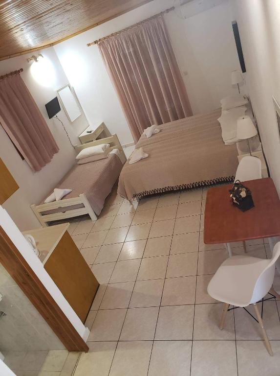 Postel nebo postele na pokoji v ubytování Marketos Apartments