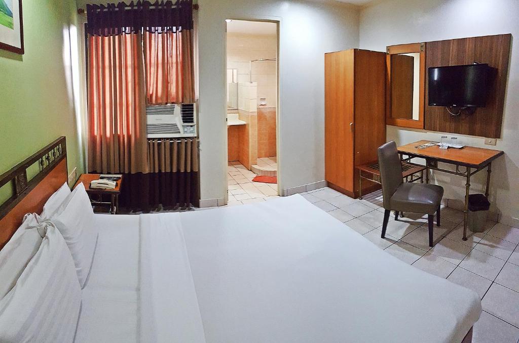 Kuchyň nebo kuchyňský kout v ubytování Golden Valley Hotel