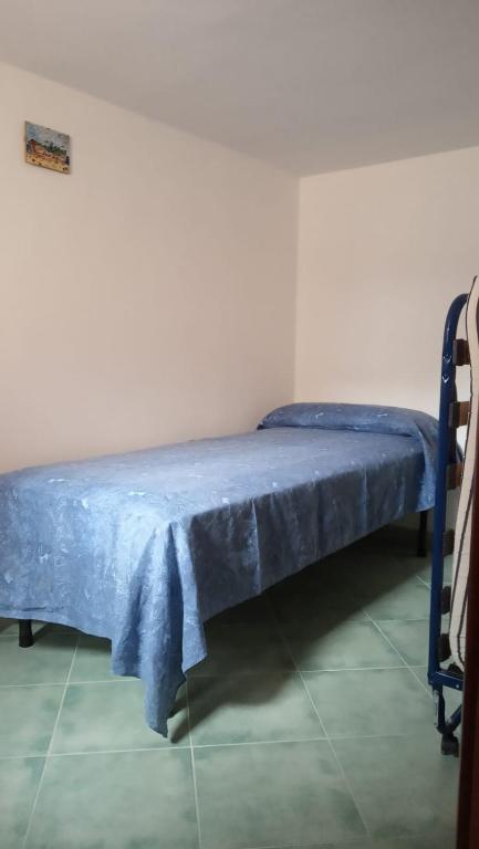 A bed or beds in a room at Petra Marina Giusy