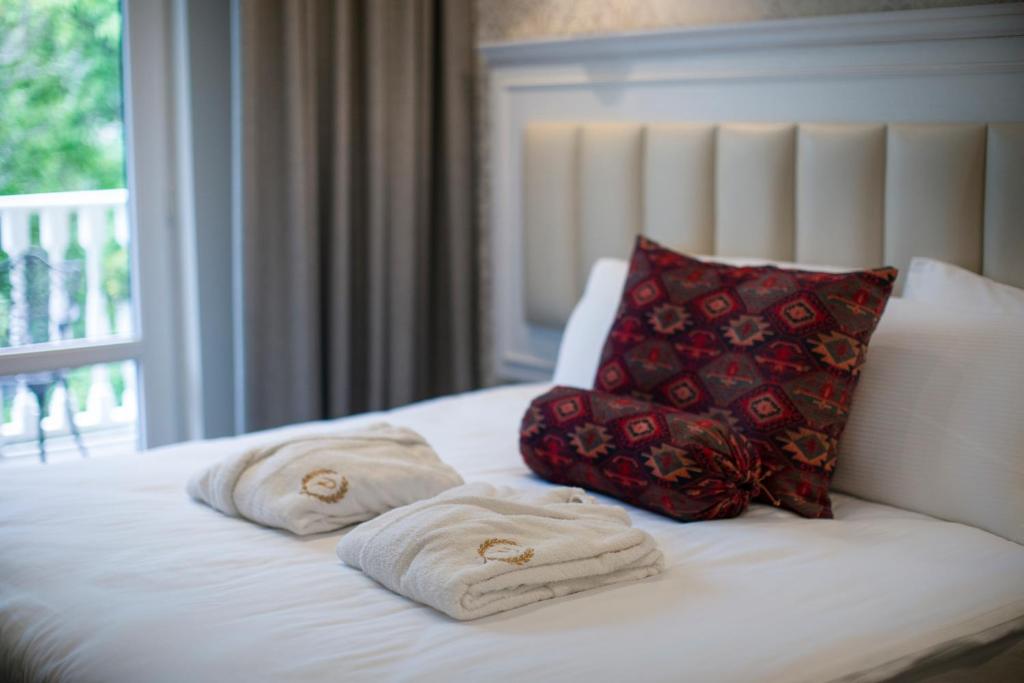 Postel nebo postele na pokoji v ubytování Hotel Passport Tbilisi