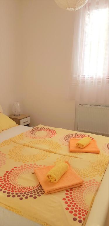 Postel nebo postele na pokoji v ubytování Apartments Korana, BelajskePoljice