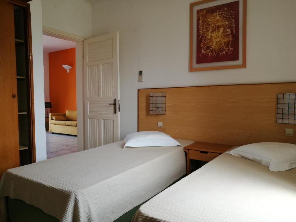 Кровать или кровати в номере Flag Hotel Foya Branca