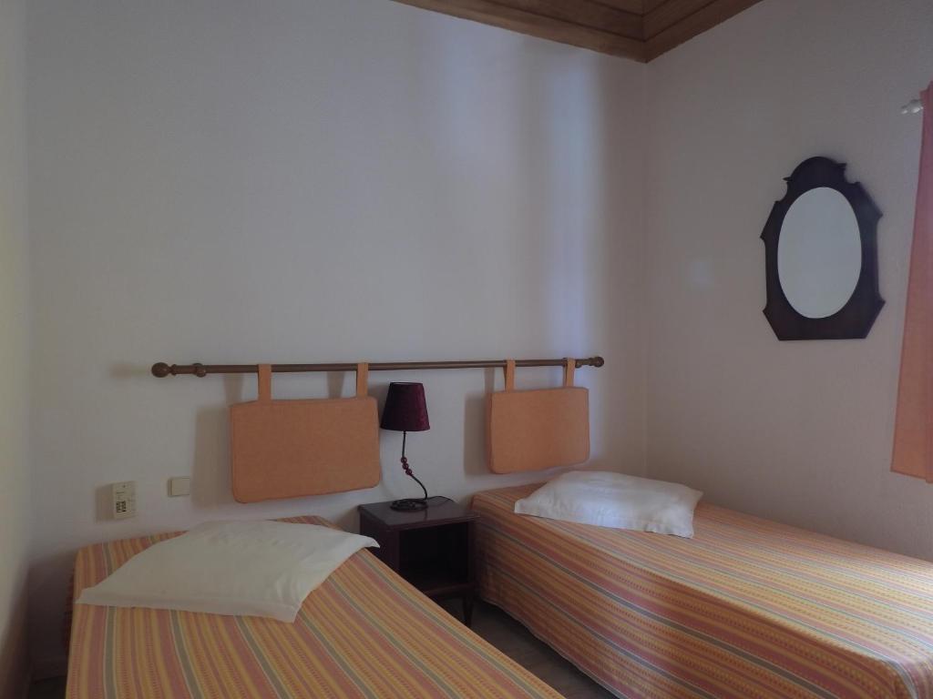 Кровать или кровати в номере Flag Hotel Foya Branca