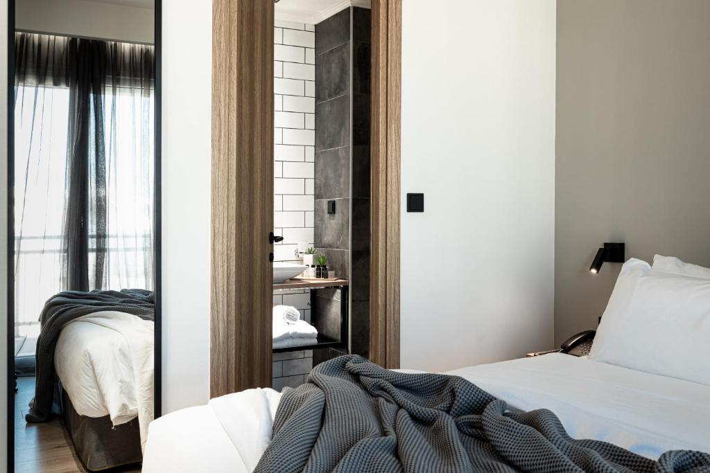 Postel nebo postele na pokoji v ubytování 31 Doors Hotel