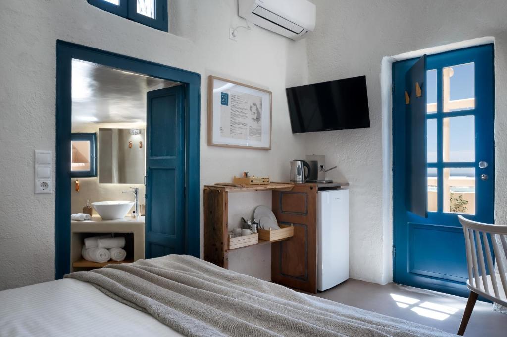 Postel nebo postele na pokoji v ubytování Nalas Suites
