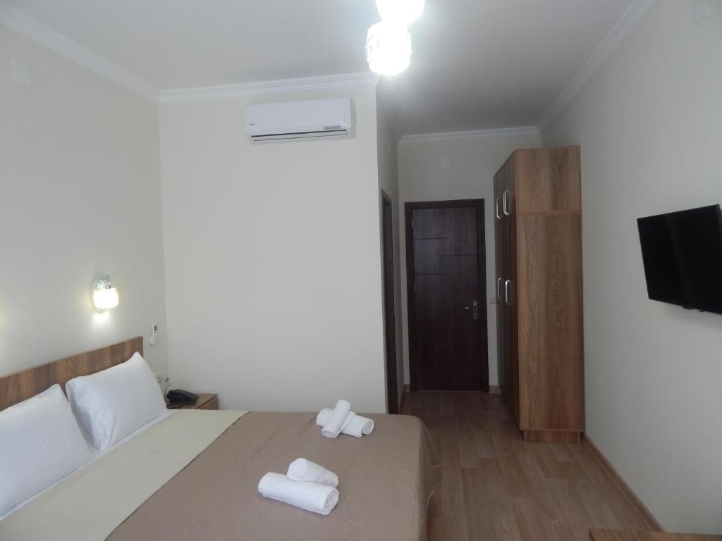 Postel nebo postele na pokoji v ubytování Hotel Belugo