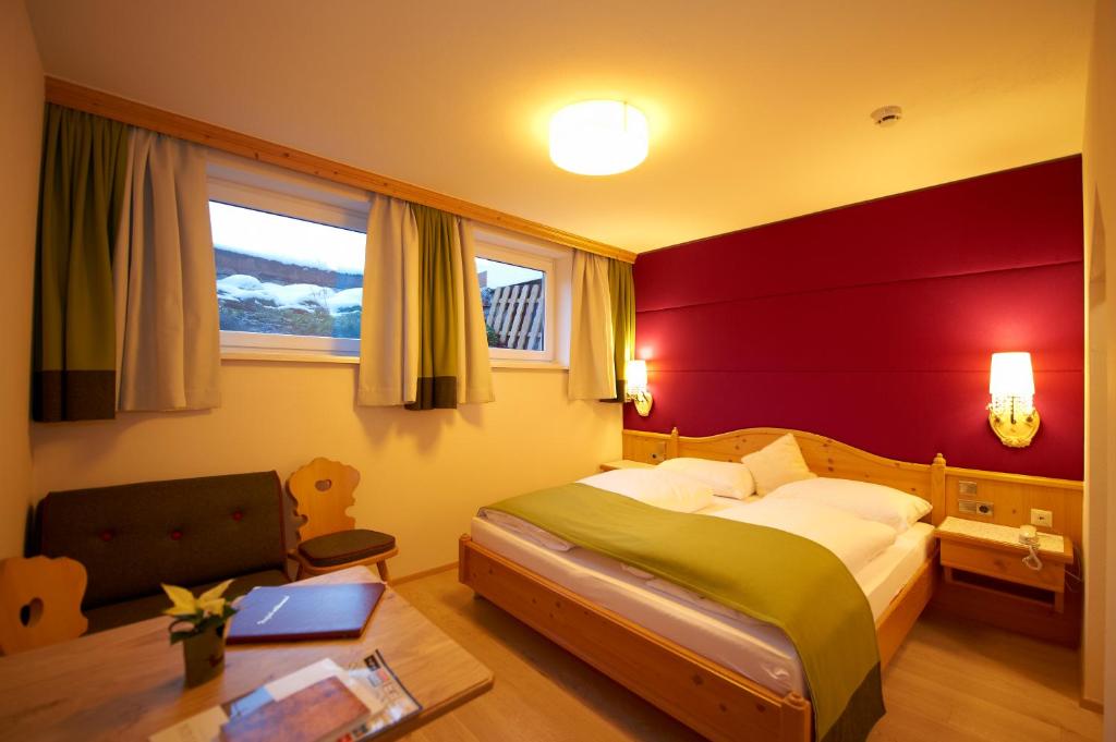 Postel nebo postele na pokoji v ubytování Hotel Lisa